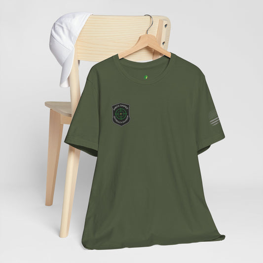 Green t-shirt with a logo on a wooden chair against a white background