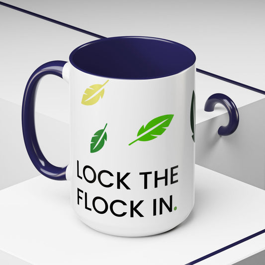 Mug with 'Lock the Flock In' text and feather graphics on a white background