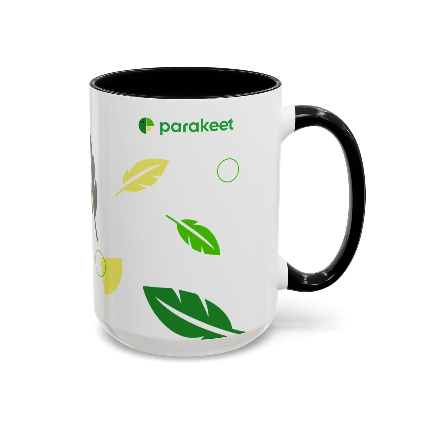 White mug with black handle featuring green and yellow leaf designs and 'parakeet' logo.